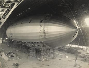 (AIRSHIPS--U.S.S. MACON) A group of 9 compelling photographs depicting the construction of the U.S.S. Macon blimp.